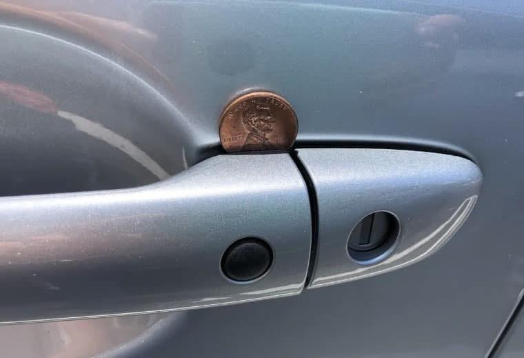 Penny Lodged In Passengers Door Handle